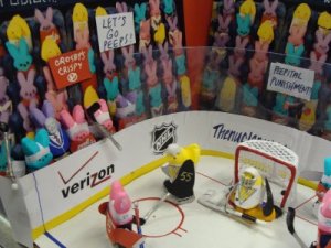 A Pens fan had to have done this. Of course, I don't know who the person holding the Crosby's Crispy sign is rooting for.