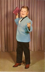 This is wrong on so many levels. He's probably saying "You're going to hell. Now hand over your wallet." This is a scam, plain and simple. Seriously, this child preacher thing is fucked up. I wonder what this kid's parents are like. 