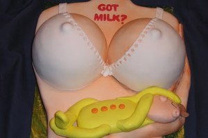 Either the designer was a guy who frequented strip clubs on a regular basis or this cake was originally made for a bachelor party of some sort but cancelled at the last minute. If it's the latter, then the baby was probably a last second addition.