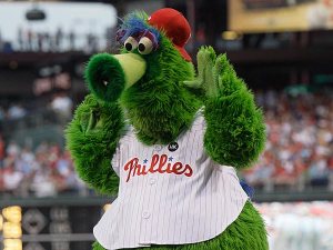 I guess since he landed on planet earth,as well as appreciating it much more than wherever he came from, the Phillie Phanatic signed to be a mascot for the Phillies. Either that, or his Philadelphia mascot gig is a backup line of work after he fail his audition for Sesame Street. We're not sure which.