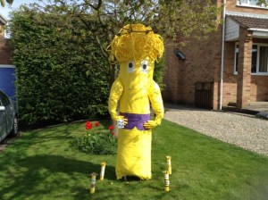 Of course, this might be at tribute to WuShock, the mascot from Wichita State, but I hope not. Still, Cheese String Man is much better as a scarecrow.