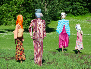 And I see this group of pumpkin headed straw stuffed people are very much styling.