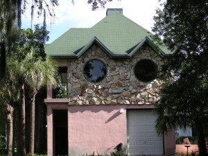 Now this house seems as if it's spying on the neighbors. Let's hope that there's no telescope behind either of the giant circular windows.