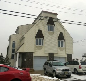 This is a place in New Jersey called, "The Bird Turd House of the Seventy Gables." It was said to be inspired by the German Coo-Coo Clock. Yet, you can see why people liken it to bird turds.
