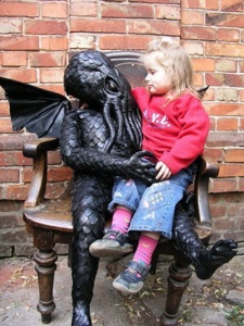 I'm sure this is nothing like having your kid sit on Santa Claus' lap. Rather this is much more disturbing since Cthulhu is pure evil. Hey, why is Cthulhu in a playground anyway?