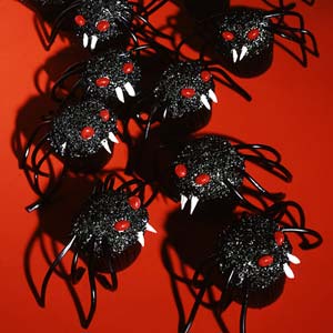 These must be the scariest cupcakes I've ever seen. Also, these spiders look as if they're out for blood and aren't very happy.