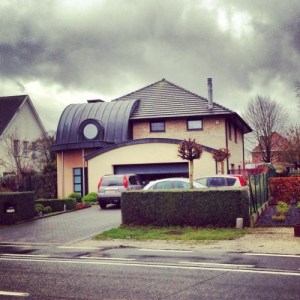 Let's just say, I wouldn't want to live in a neighborhood with a house like this. Besides, I don't think the small warehouse garage and the awning like front part go well with the rest of the house either.