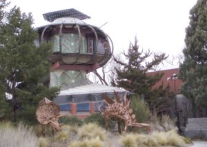 Then again, I think a dinosaur quashing it might improve its looks. I mean it just seems more like a house I'd see aliens living in who miss the architecture from their planets.