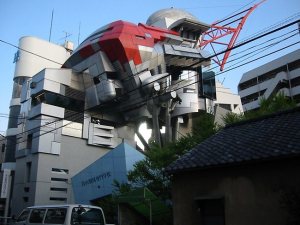 I think this building is for a technical college in Japan. Still, while the figurehead looks a mix between Speed Racer and Robocop, it's fairly fitting actually. And we're well aware that Japan has a reputation with creating robots to do more things than anyone ever thought of.