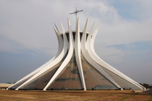 This is Brazil's Metropolitana de Nossa Senhora Aparecida in Brasilia as well as the seat for its local Catholic Archdiocese. It was built in the 1970s and certainly looks like it.  The interior is a combination of a church atmosphere and almost being devoured by a giant squid.