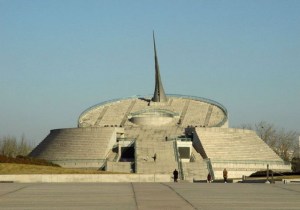 This monument is in Beijing and it seems to resemble something from the former Soviet Union than anything. As with the giant needle sticking out, I have no idea.