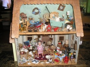 This woman really needs to clean her house. And I suppose that she has a ton of cats as well. Still, this is a doll house you'd give to a young girl.