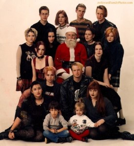 Santa Claus: "Great, now I have to pose in this photo with these metal fan kids and their kids. I need a vacation." Love Santa's expression in this.
