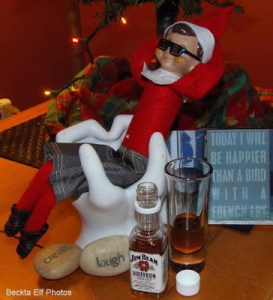 Yet, I'm not sure if Elsie's idea of relaxation method of lounging in a denim skirt and sandals while drinking Jim Beam will go well with Santa at the North Pole.