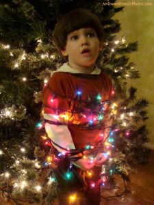 I don't know why anyone would want to tie their kid up in Christmas lights for a photo. That's really messed up.