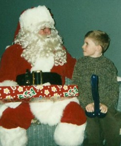 Now this Santa and kid photo op is quite awkward because there's something rather inappropriate about it. And I don't think Santa putting his arm around the boy does anything to help.
