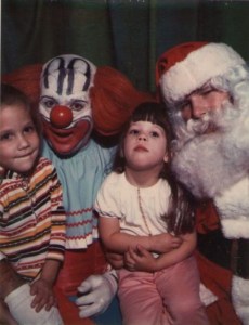 Seems like Santa doesn't enjoy sharing the spotlight this Christmas season,especially with a clown that is more suitable for Halloween nightmares. Still, I'm sure the clown is going to get it once he and Santa get off from work.
