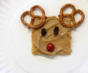 Cute to add the pretzel antlers, the raisin eyes, and the red cherry tomato nose. Still, the kids would love this.