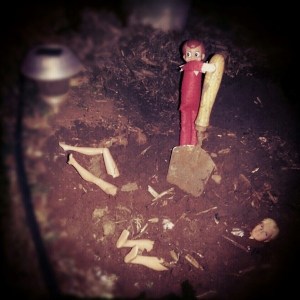 Looks, like he caught Barbie and Ken together and he shot them dead. Either that, or he's just one sick evil bastard elf who should be reported to Santa.