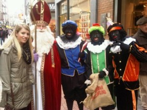 For those not familiar with David Sedaris, this picture was taken in the Netherlands. While we all seem to recognize Saint Nicholas as the bearded white guy, those three guys in blackface are 3 of the 6 to 8 black men. Of course, this is the main reason why I wouldn't recommend black people to travel to the Netherlands at this time in December.