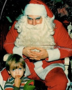 Santa seems to be plotting something and I don't like the look on his face either. Neither does the boy. Seriously, how can anyone think Santa doesn't look evil in this?