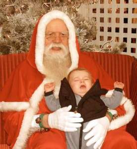 I don't know about you but if this photo didn't take place somewhere in Europe, then the Santa hood has got to go. Otherwise, Santa looks like some evil red cloaked wizard.