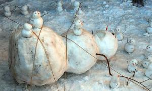 I suppose this snowman feels trapped under the ropes of the smaller ones who tied him up. Still, pretty clever.