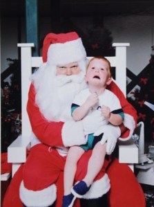From Neatorama: "Indeed, poor little Zak looks like he’s being kidnapped for ransom money by this gruff-looking Mr. Claus."