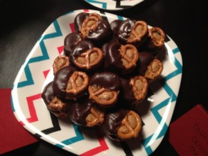 I like how these pretzels are filled with peanut butter and are half covered in chocolate. Can I take one, please?
