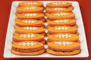 Now these bites seem to contain, Ritz crackers, kielbasa slices, and cheddar cheese. And I guess the lines are drawn with salad dressing.