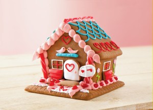Sure gingerbread houses are mostly associated with Christmas. Yet, this one's a Valentine's Day one. Oh, and this one even has a little mailbox. Still, it's probably not for eating.