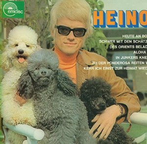 Okay, I don't know about you, but I fear for the dogs' safety if they had an owner like that. Still, since 1966, he's been one of Germany's most successful recording artists selling 50 million albums and still going strong. Also been married 3 times. He's even creepier without his glasses. Still, he must have something since he's put out a lot of albums with terrible covers.