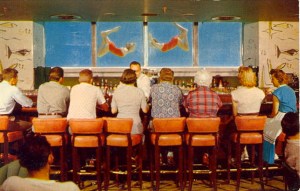 Now a bar overlooking a giant fish tank is one thing, but this is kind of ridiculous. Might also make the patrons wonder whether they're seeing things or just need another drink. I'd hate to be the designated driver in that bunch.