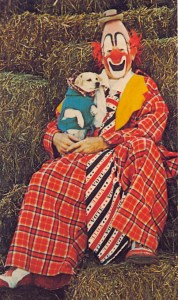 I don't know about you but upon seeing this picture, I kind of feel like calling the Humane Society regarding Rover's welfare and whether Bobo is a good owner outside his creepy clown costume. Because the poor dog looks so terrified.
