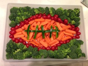 Have to love how the old pig skin is made from peppers, carrots, and cherry tomatoes. The turf is represented by the broccoli.