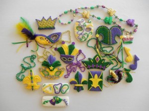 Now these come from a website called Custom Cookies.com so they're professionally made. Items include jester hats, jesters, crowns, the Fleur de Lis, beads, masks, and music notes.