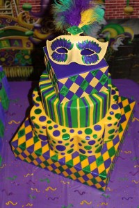 Now I love how these tiers don't seem to look the same. I especially like the mask on top with the feathers and stickers. So pretty.