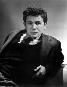 John Garfield was once a promising young actor known to play brooding, rebellious, working class characters. Yet, he made the unfortunate mistake of marrying a former Communist that resulted in him being blacklisted during McCarthyism, which cost his career.