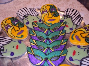 Of course, we have a couple designs of Mardi Gras masks along with a face with dangling notes and piano hair as I see it at least. Yes, these were undoubtedly made in the Big Easy.