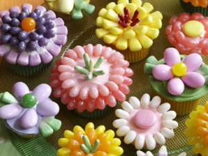 Now these cupcakes are decorated with Easter candy corn and jelly beans. But though these flowers may be pretty, the toppings may hardly be edible.