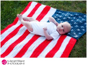Sure this may be a heartwarming photo of patriotic cuteness. But the US flag code states you shouldn't let it touch the ground or put anything on it. Babies included.
