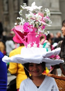 Now that watering can display is pretty. But I wonder if this girl is going to need a neck massage after the Easter parade though.