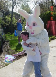 Seriously, that boy must be on something since nobody smiles when a giant ferocious Easter Bunny puts their arms around them before dragging them to their untimely deaths.