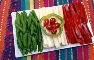 Now these consist of pea pods, red peppers, cheese sticks, and cherry tomatoes. So it's not quite like a veggie tray but close.