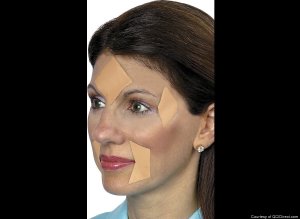 I'm sure these Botox band-aids will retrain her facial muscles and restore lost youthful beauty without surgery, lotions, or exercises. Either that, or make her look like an idiot with cut out band-aids on her face.