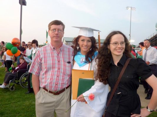 Me with my father and sister at my sister's high school graduation in 2011.