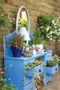 I'm sure you can't put clothes in this. But flowers it will do. Hope the rain doesn't take the paint off.