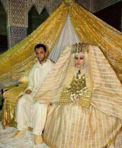 I'm sure part of the curtain rod is within her wedding crown piece. Still, I've seen nice Muslim style wedding dresses and some of them are quite nice. This one is beyond tacky. Still, kind of reminds me of what you'd see an Egyptian Pharaoh would wear in increment weather.