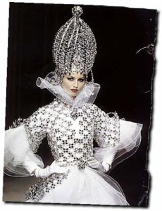 While this is said to enhance her as some exotic princess in Eastern Europe, she more or less tends to remind me more of the Chrysler Building. That or a possible lady in waiting to the Queen of Hears from Alice in Wonderland.