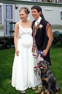 This photo seems to have all the trappings of a shotgun wedding. I mean the bride is obviously pregnant but there's nothing really objectionable about her dress. However, the groom's only formal attire is a black vest and possibly a white collar and tie. And I suppose the plaid shirt and pants have seen better days. Seriously, a guy should look his best on his wedding day, not like he's just marrying the girl to escape the wrath of daddy's shotgun!